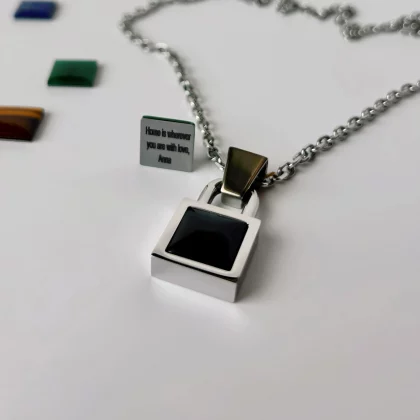 Detail view of engraved message on men’s Black Agate pendant – Jewel Cocktail