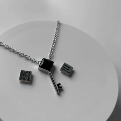 Women’s key-shaped pendant “Key of Strength” featuring natural Black Agate and hidden QR-coded message